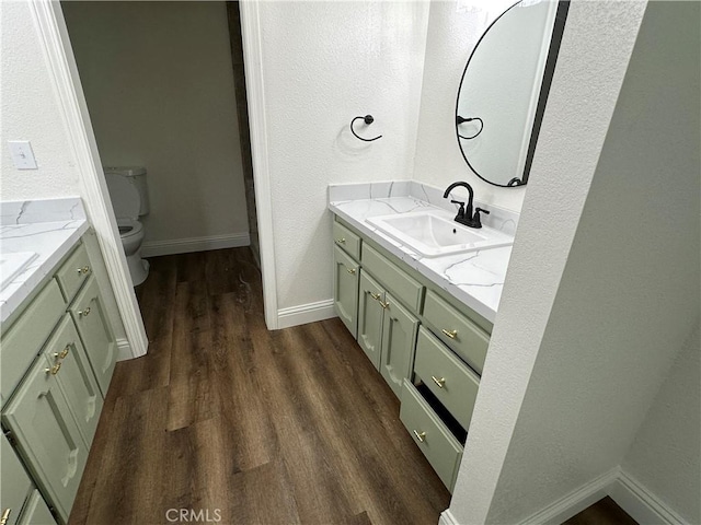899 La Jolla Way, Merced, CA 95348 - bathroom featuring vanity, wood finished floors, and a textured wall