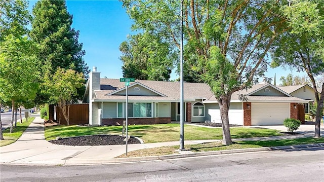899 La Jolla Way, Merced, CA 95348 - ranch-style house with brick siding, driveway, a garage, and a shingled roof