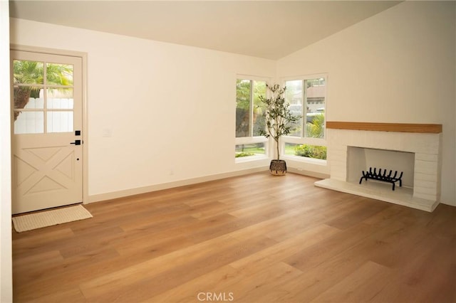 4313 Sea Bright Dr, Carlsbad, CA 92008 - unfurnished living room featuring wood finished floors, a fireplace, and vaulted ceiling