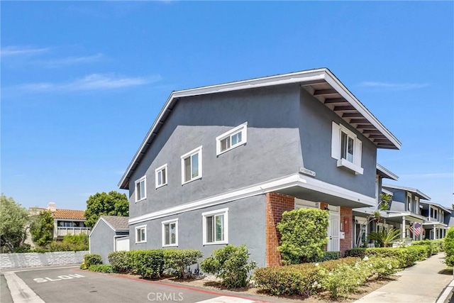 195 Morristown Ln, Costa Mesa, CA 92626 - view of side of home with stucco siding and brick siding