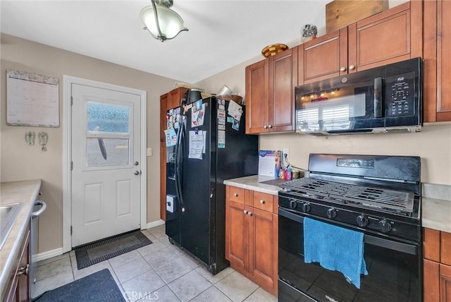 195 Morristown Ln, Costa Mesa, CA 92626 - kitchen featuring black appliances, brown cabinets, and light countertops