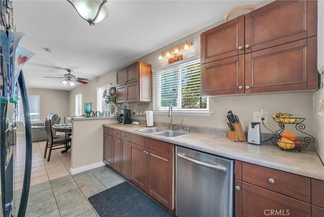 195 Morristown Ln, Costa Mesa, CA 92626 - kitchen with stainless steel dishwasher, light tile patterned floors, a ceiling fan, and light countertops