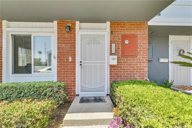 195 Morristown Ln, Costa Mesa, CA 92626 - view of exterior entry featuring brick siding