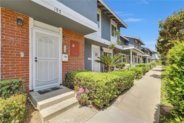 195 Morristown Ln, Costa Mesa, CA 92626 - view of exterior entry with brick siding and stucco siding
