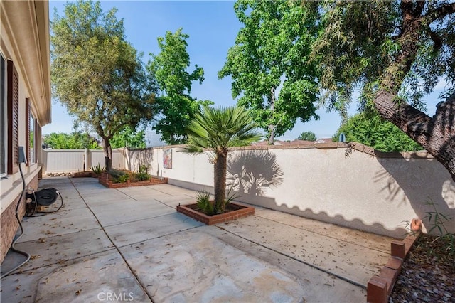 1706 Brittney Rd, Beaumont, CA 92223 - fenced backyard featuring a patio area