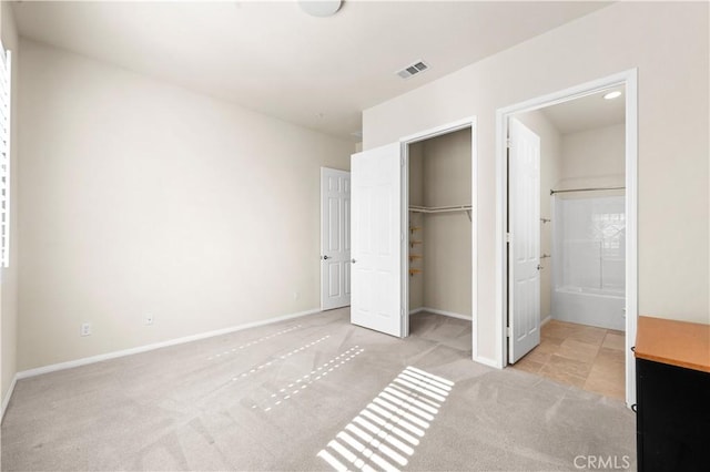 1706 Brittney Rd, Beaumont, CA 92223 - unfurnished bedroom featuring carpet, a closet, ensuite bath, and a spacious closet