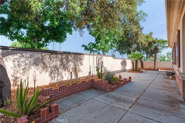 1706 Brittney Rd, Beaumont, CA 92223 - fenced backyard featuring a patio area