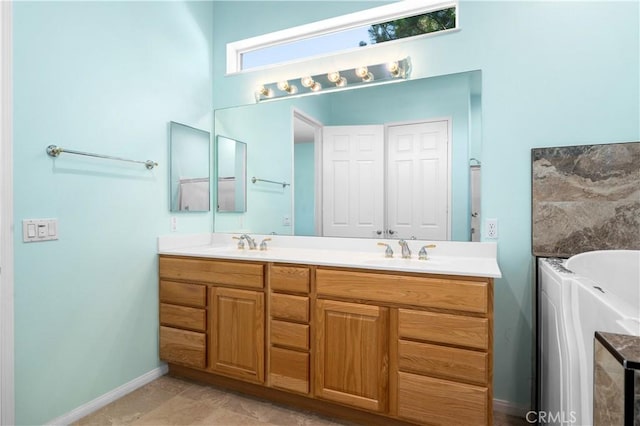 1706 Brittney Rd, Beaumont, CA 92223 - bathroom featuring double vanity and a tub