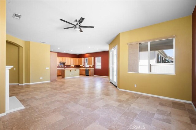 1706 Brittney Rd, Beaumont, CA 92223 - unfurnished living room featuring a ceiling fan, arched walkways, and recessed lighting