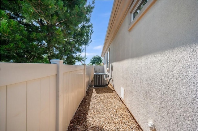 1706 Brittney Rd, Beaumont, CA 92223 - view of side of home featuring a central air condition unit and stucco siding
