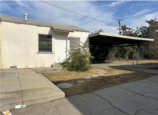 5938 Alessandro Ave, Temple City, CA 91780 - view of property exterior with stucco siding and a carport