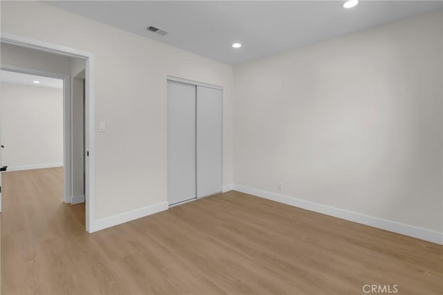 12815 Rexton St, Norwalk, CA 90650 - unfurnished bedroom with light wood-style flooring, recessed lighting, and a closet