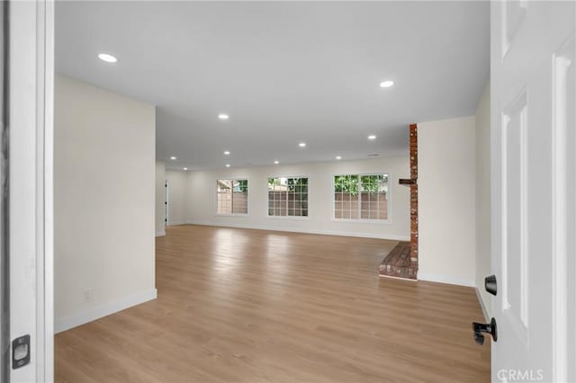 12815 Rexton St, Norwalk, CA 90650 - unfurnished living room with light wood finished floors, plenty of natural light, and recessed lighting
