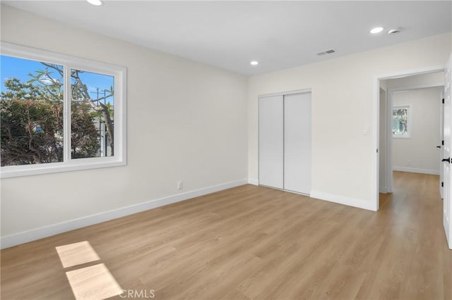 12815 Rexton St, Norwalk, CA 90650 - unfurnished bedroom with light wood-type flooring, recessed lighting, and a closet