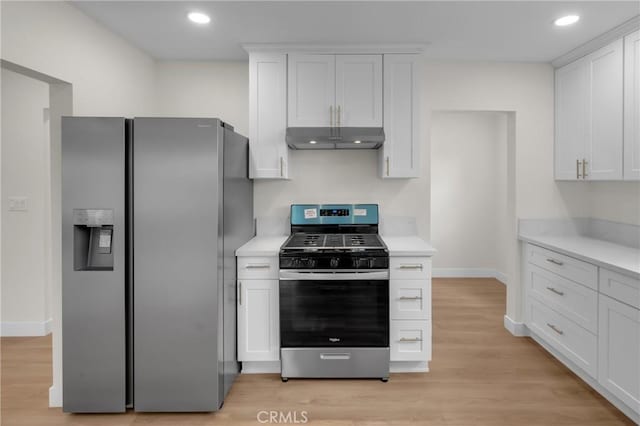 12815 Rexton St, Norwalk, CA 90650 - kitchen featuring stainless steel appliances, under cabinet range hood, light countertops, white cabinets, and light wood-type flooring