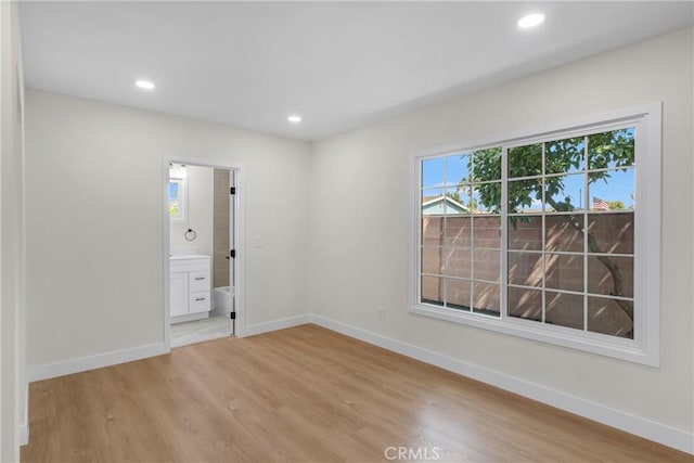 12815 Rexton St, Norwalk, CA 90650 - empty room featuring light wood-style floors and recessed lighting