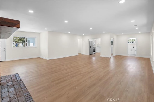 12815 Rexton St, Norwalk, CA 90650 - unfurnished living room featuring recessed lighting and light wood-style floors