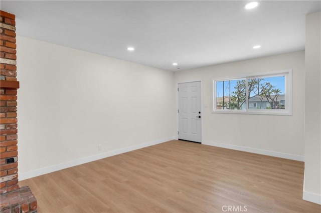 12815 Rexton St, Norwalk, CA 90650 - unfurnished living room with light wood finished floors and recessed lighting