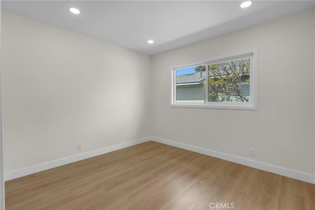 12815 Rexton St, Norwalk, CA 90650 - empty room featuring light wood finished floors and recessed lighting