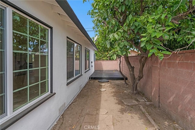 12815 Rexton St, Norwalk, CA 90650 - view of home's exterior with a fenced backyard, stucco siding, and a patio