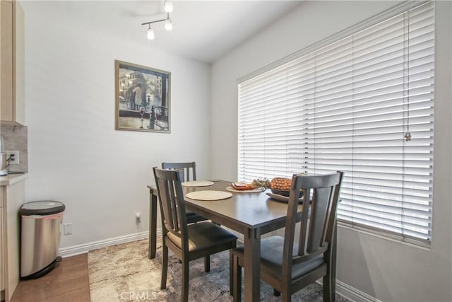 527 Cedar Ave Unit 2K, Long Beach, CA 90802 - dining space featuring wood finished floors and healthy amount of natural light