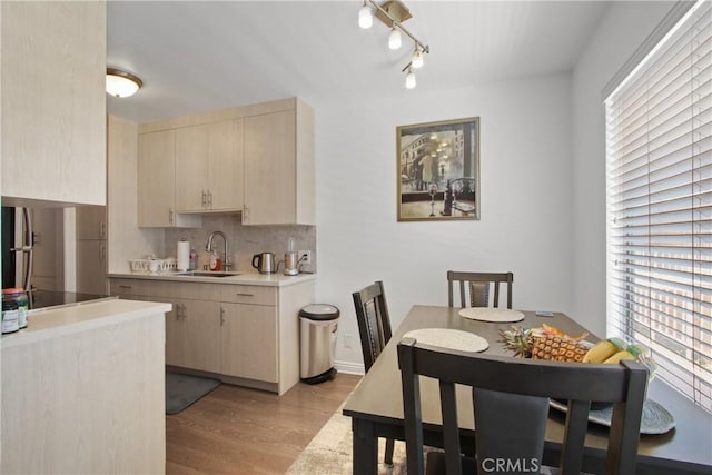 527 Cedar Ave Unit 2K, Long Beach, CA 90802 - dining area featuring light wood finished floors, healthy amount of natural light, and rail lighting