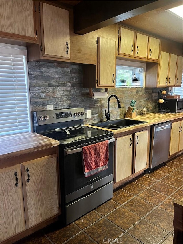 6070 Manzanita Ct, Angelus Oaks, CA 92305 - kitchen with stainless steel appliances, decorative backsplash, and light brown cabinets