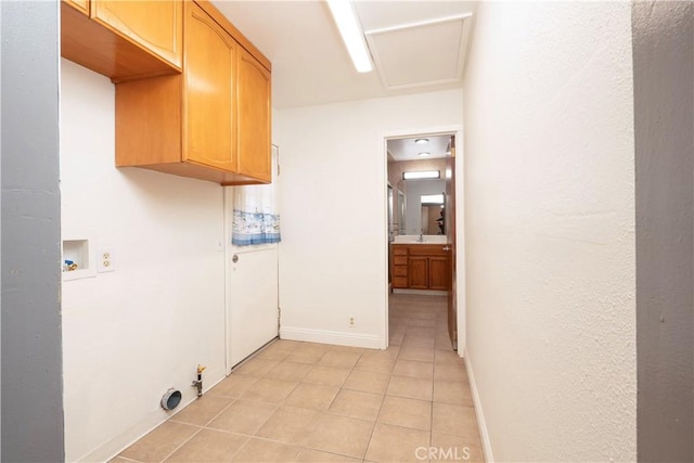 12711 Leroy Ave, Garden Grove, CA 92841 - laundry room featuring cabinet space, light tile patterned flooring, washer hookup, and attic access