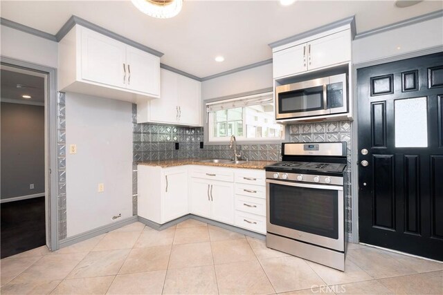 12711 Leroy Ave, Garden Grove, CA 92841 - kitchen featuring stainless steel appliances, ornamental molding, white cabinets, tasteful backsplash, and stone countertops