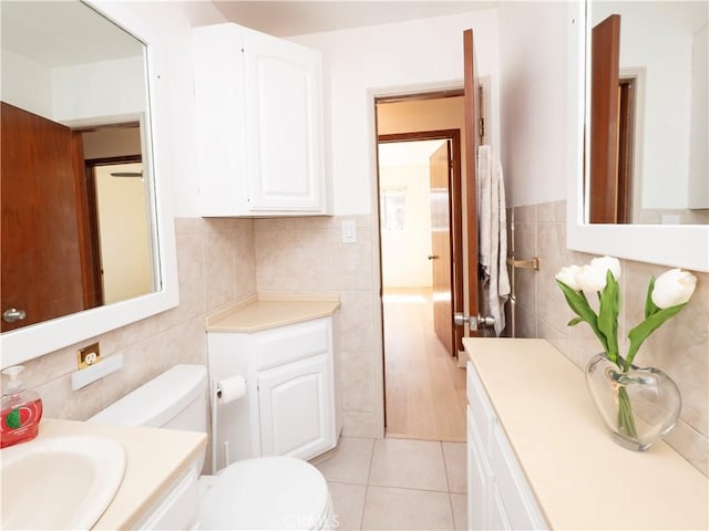 12711 Leroy Ave, Garden Grove, CA 92841 - bathroom featuring tile walls, vanity, and tile patterned floors