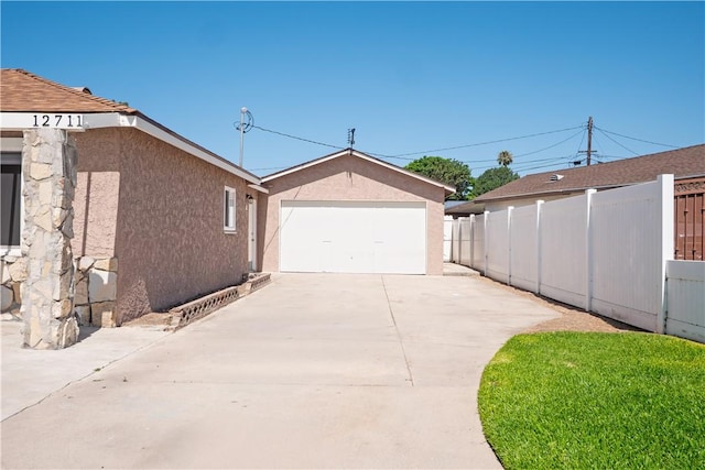 12711 Leroy Ave, Garden Grove, CA 92841 - view of property exterior with concrete driveway, stucco siding, and a garage