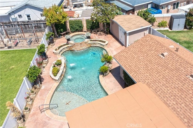 12711 Leroy Ave, Garden Grove, CA 92841 - view of pool featuring a storage unit, a fenced backyard, a patio area, and a pool with connected hot tub
