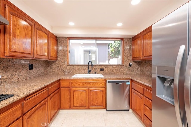 12711 Leroy Ave, Garden Grove, CA 92841 - kitchen featuring appliances with stainless steel finishes, brown cabinetry, tasteful backsplash, and recessed lighting
