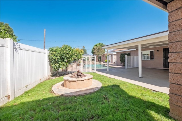 12711 Leroy Ave, Garden Grove, CA 92841 - fenced backyard featuring a fire pit and a patio area