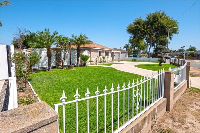 12711 Leroy Ave, Garden Grove, CA 92841 - fenced yard featuring concrete driveway