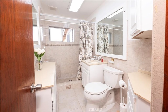 12711 Leroy Ave, Garden Grove, CA 92841 - full bathroom featuring tile walls, vanity, a tile shower, and tile patterned flooring