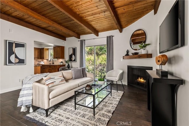 4230 Whitsett Ave Unit 6, Studio City, CA 91604 - living area with wooden ceiling, dark wood-style flooring, and a warm lit fireplace