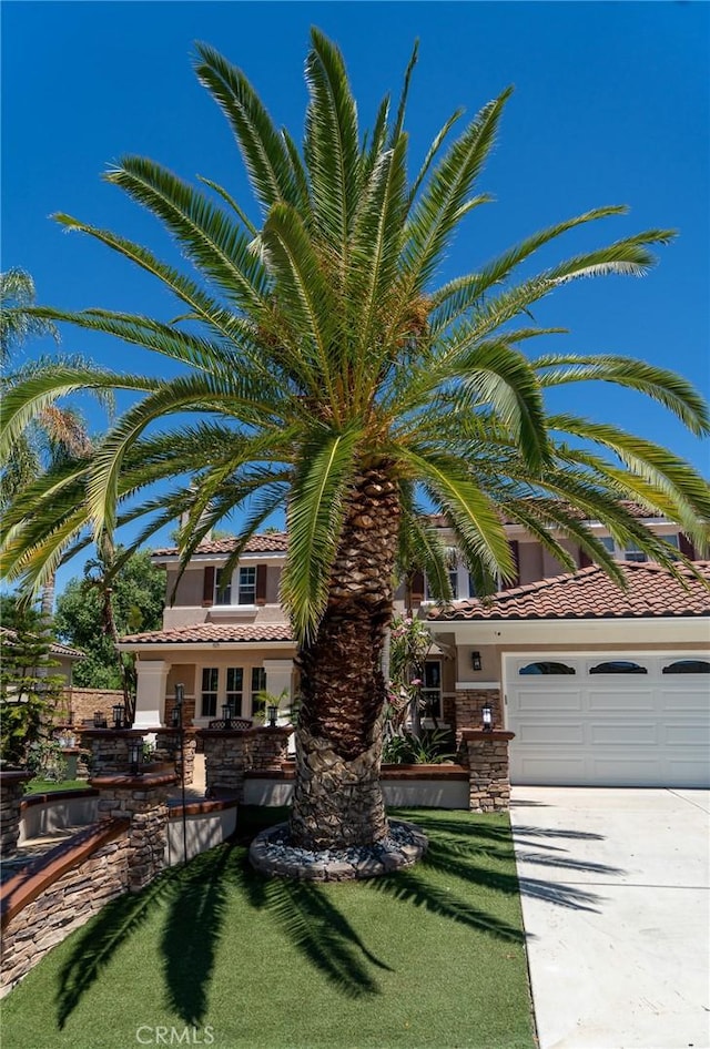 2417 Lenai Cir, Corona, CA 92879 - view of front of property with stucco siding, a tile roof, driveway, and stone siding