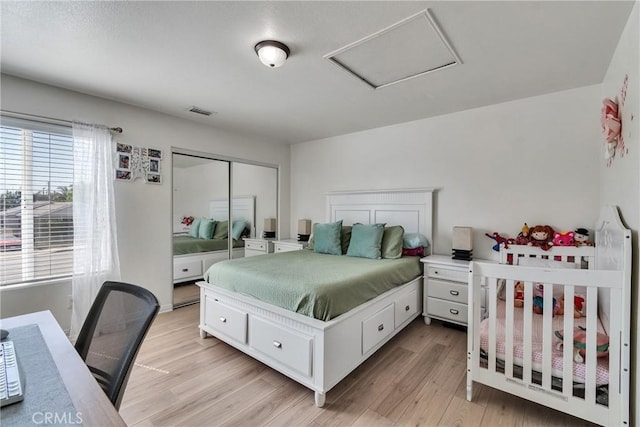 8630 Elba St, Pico Rivera, CA 90660 - bedroom featuring attic access, light wood-style floors, and a closet