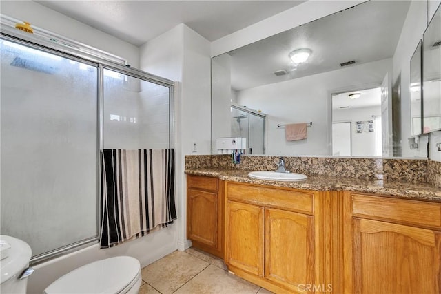 8630 Elba St, Pico Rivera, CA 90660 - full bathroom featuring vanity, tile patterned floors, and shower / bath combination with glass door