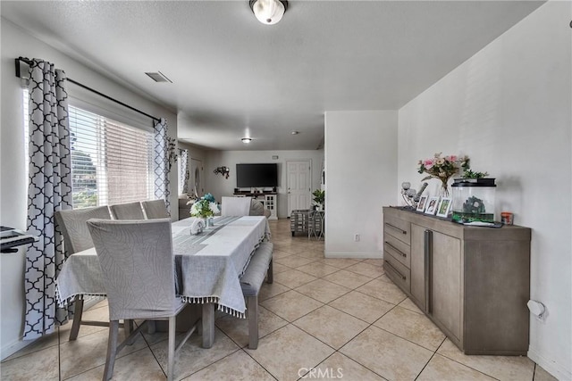 8630 Elba St, Pico Rivera, CA 90660 - dining room featuring baseboards and light tile patterned flooring