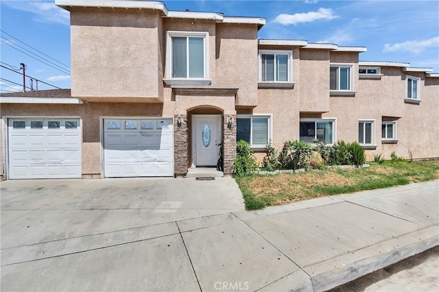 8630 Elba St, Pico Rivera, CA 90660 - townhome / multi-family property featuring driveway and stucco siding