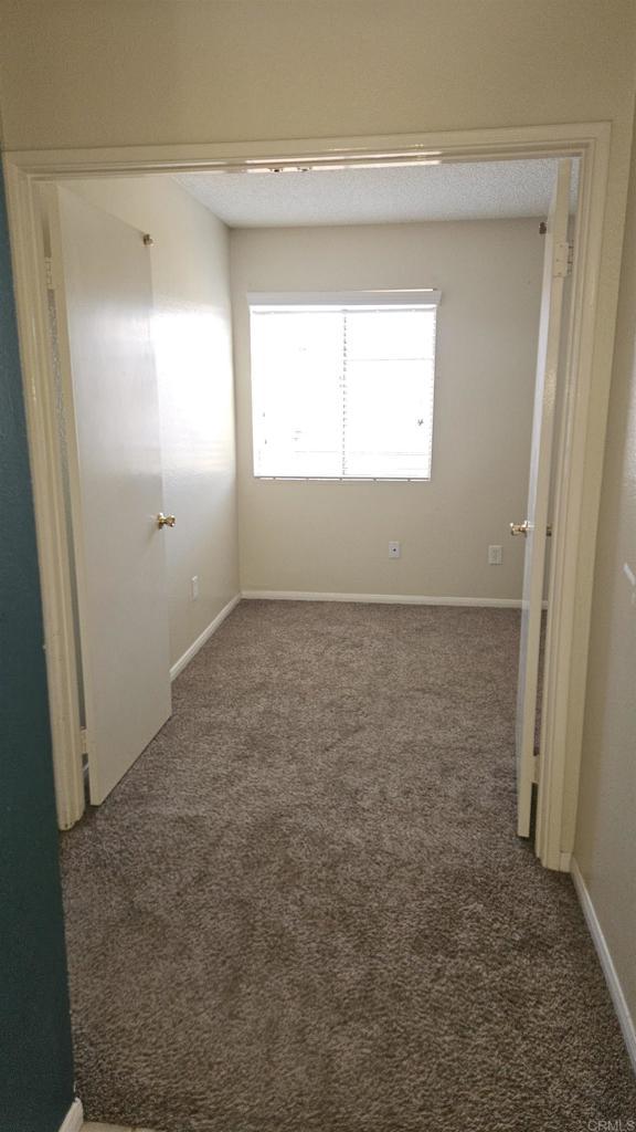 4028 Johnson Dr, Oceanside, CA 92056 - unfurnished room featuring carpet and baseboards