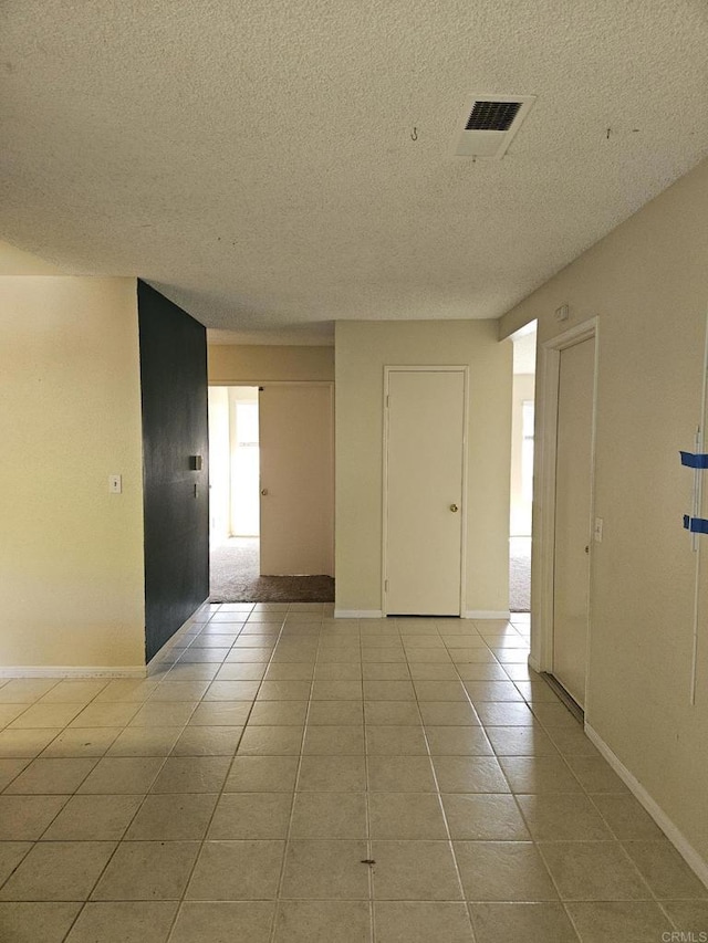 4028 Johnson Dr, Oceanside, CA 92056 - tiled spare room with a textured ceiling and baseboards