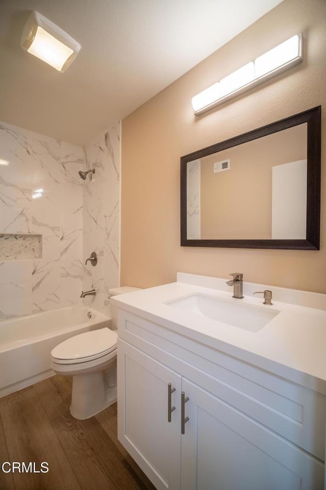 1100 Dahlia St, Oxnard, CA 93036 - full bathroom featuring vanity, wood finished floors, and shower / washtub combination