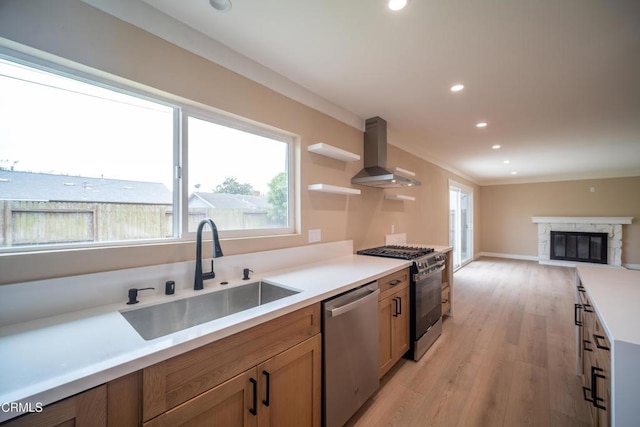 1100 Dahlia St, Oxnard, CA 93036 - kitchen with stainless steel appliances, wall chimney exhaust hood, light wood finished floors, recessed lighting, and open floor plan