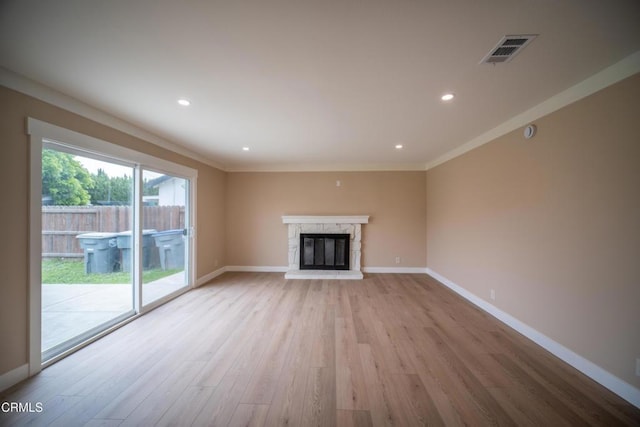 1100 Dahlia St, Oxnard, CA 93036 - unfurnished living room featuring light wood-style floors, a fireplace, recessed lighting, and crown molding