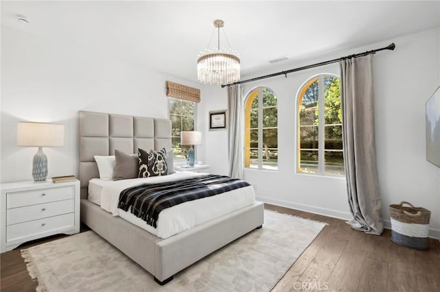 24 Tesoro, Irvine, CA 92618 - bedroom featuring hardwood / wood-style floors and a chandelier