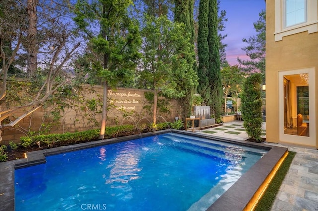 24 Tesoro, Irvine, CA 92618 - pool at dusk featuring a fenced backyard and a patio