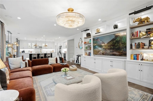 24 Tesoro, Irvine, CA 92618 - living room with wood finished floors, recessed lighting, a chandelier, and built in shelves